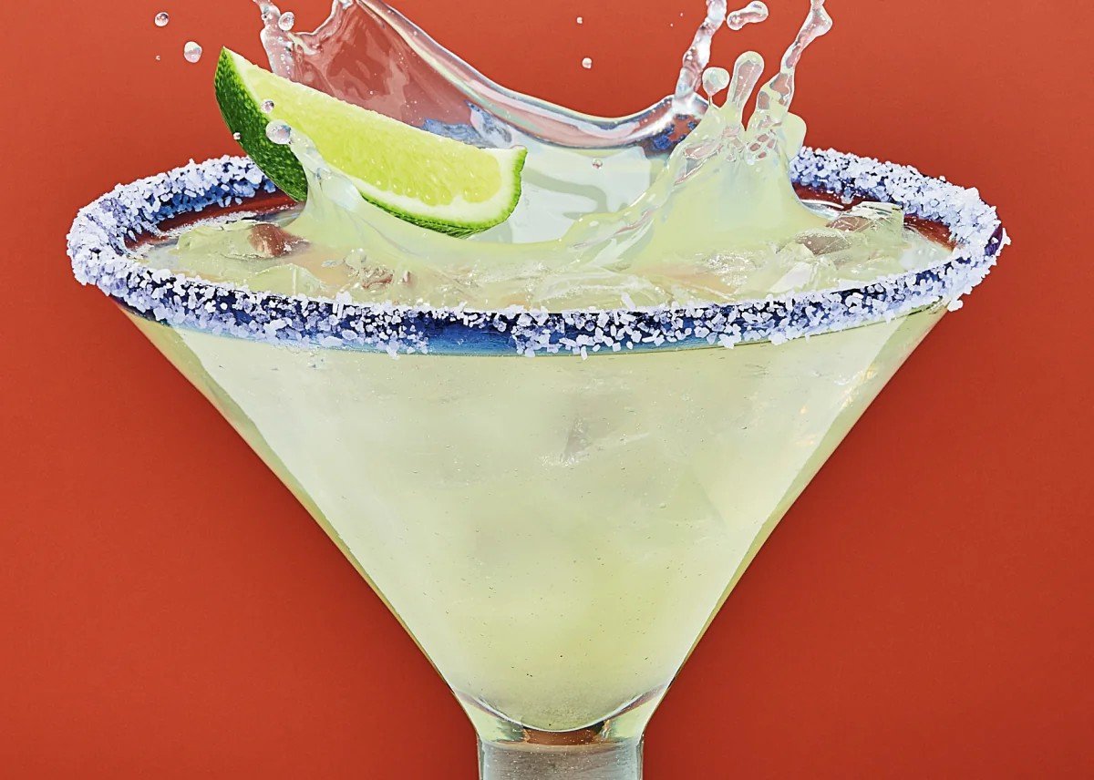 Classic margarita with a lime wedge