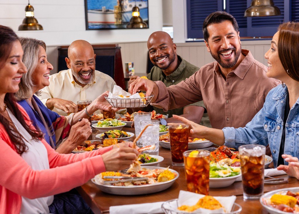 Friends and family sharing a seafood meal together at Red Lobster
